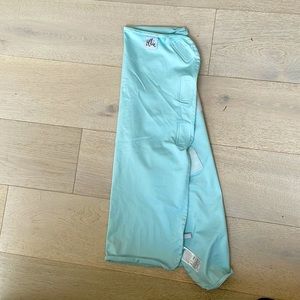 The Ollie baby swaddle. Mint green color.